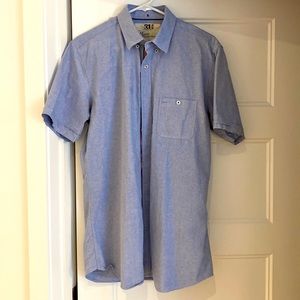 Simons light blue shirt.